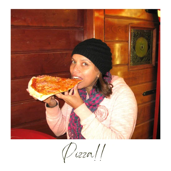 Lu enjoying a large slice of Pizza!