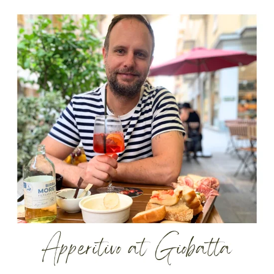 Justin enjoying a Campari Spritz and aperitivo at Giobatta